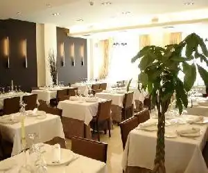 Hotel Asador H.M. Versus